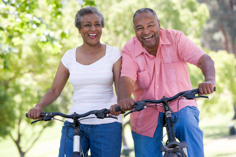 Elderly couple on bikes